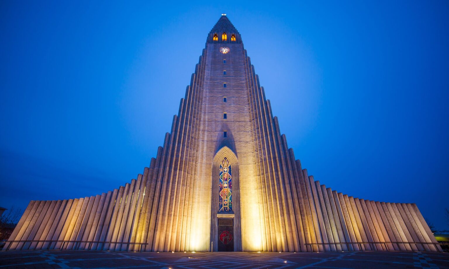 Reykjavik, Iceland Guide: Everything You Need to Know Before Visiting Introduction Nestled on the edge of the Arctic Circle, Reykjavik, Iceland's capital, is a city of contrasts, where modernity meets ancient landscapes. From the vibrant streets adorned with colorful houses to the breathtaking natural wonders just beyond its borders, Reykjavik offers a unique and unforgettable experience for travelers. Before embarking on your journey to this enchanting city, here's everything you need to know: Getting There: Reykjavik is well-connected by air, with the Keflavik International Airport serving as the main gateway to the country. From the airport, you can reach the city center by shuttle bus, taxi, or rental car. Alternatively, you can opt for domestic flights from other parts of Iceland if you're already within the country. Accommodation: Reykjavik offers a range of accommodation options to suit every budget and preference. From luxurious hotels with panoramic views of the surrounding landscapes to cozy guesthouses and hostels, there's something for everyone. It's advisable to book your accommodation in advance, especially during peak tourist seasons, to ensure availability. Weather: Iceland's weather is notoriously unpredictable, with conditions changing rapidly throughout the day. Summers are mild, with temperatures averaging around 10-15°C (50-59°F), while winters are cold, with temperatures often dipping below freezing. Regardless of the season, it's essential to pack layers and waterproof clothing to prepare for any weather conditions. Currency: The official currency of Iceland is the Icelandic Krona (ISK). While credit and debit cards are widely accepted in Reykjavik, it's advisable to carry some cash for smaller purchases and transactions, especially when venturing into more remote areas. Language: The official language of Iceland is Icelandic, but English is widely spoken and understood, particularly in tourist areas. Learning a few basic phrases in Icelandic, such as "Takk" (thank you) and "Góðan daginn" (good day), can go a long way in showing respect for the local culture. Things to Do: Explore the City Center: Wander through Reykjavik's charming streets lined with colorful houses, boutique shops, and cozy cafes. Don't miss iconic landmarks such as Hallgrimskirkja Church, Harpa Concert Hall, and the Sun Voyager sculpture. Sample Icelandic Cuisine: Indulge in traditional Icelandic dishes such as fermented shark, lamb stew, and skyr (Icelandic yogurt). For a culinary adventure, be sure to try some of Reykjavik's renowned seafood restaurants. Chase the Northern Lights: Experience the awe-inspiring beauty of the Northern Lights, a natural phenomenon that graces Iceland's skies during the winter months. Join a guided tour to increase your chances of witnessing this magical spectacle. Relax in the Blue Lagoon: Take a day trip to the Blue Lagoon, a geothermal spa located just outside Reykjavik. Immerse yourself in the warm, mineral-rich waters while surrounded by Iceland's otherworldly landscape. Discover Natural Wonders: Embark on day trips to explore Iceland's breathtaking natural wonders, including the Golden Circle route, Thingvellir National Park, Gullfoss waterfall, and the geysers of Haukadalur. Safety Tips: While Iceland is considered one of the safest countries in the world, it's essential to take precautions to ensure a safe and enjoyable trip. Be mindful of your surroundings, especially when exploring remote areas, and always adhere to local guidelines and regulations, particularly when venturing into the wilderness. Frequently Asked Questions: Reykjavik, Iceland Guide Planning a trip to Reykjavik, Iceland, and not sure where to start? From its stunning natural landscapes to its vibrant cultural scene, Reykjavik offers a unique blend of experiences for travelers. Here are some frequently asked questions to help you navigate your visit to this fascinating city. 1. When is the best time to visit Reykjavik? Reykjavik experiences a cool temperate climate, with summers being mild and winters chilly. The best time to visit depends on your preferences. Summer, from June to August, brings milder weather, longer daylight hours, and the opportunity to explore the city's outdoor attractions. However, winter, from December to February, offers a chance to witness the mesmerizing Northern Lights. Consider your interests and activities before planning your trip. 2. What should I pack for my trip to Reykjavik? Packing for Reykjavik requires preparation for variable weather conditions. Even in summer, temperatures can be cool, so bring layers including a waterproof jacket, warm sweaters, and sturdy walking shoes. In winter, pack insulated clothing, waterproof outer layers, gloves, hats, and sturdy boots. Don't forget your swimsuit for a dip in one of Reykjavik's geothermal pools! 3. How do I get around Reykjavik? Reykjavik is a walkable city, and many of its attractions are within walking distance of each other in the downtown area. Additionally, the city has an efficient public transportation system consisting of buses. Taxis and rideshare services are also available for convenience. If you plan to explore beyond the city, renting a car is recommended for flexibility and access to remote areas. 4. What are the must-visit attractions in Reykjavik? Reykjavik offers a variety of attractions for visitors. Don't miss the iconic Hallgrímskirkja Church for panoramic views of the city, the colorful houses of the Old Harbor, and the lively streets of Laugavegur for shopping and dining. Explore the city's rich cultural scene by visiting museums like the National Museum of Iceland and the Reykjavik Art Museum. Nature lovers will appreciate excursions to nearby sites such as the Blue Lagoon, Golden Circle, and Þingvellir National Park. Conclusion: Reykjavik, Iceland's capital, is a city unlike any other, where modernity and nature converge to create a truly unique and unforgettable experience. Whether you're exploring the vibrant streets of the city center, marveling at the Northern Lights, or immersing yourself in the country's rich cultural heritage, Reykjavik has something to offer every traveler. By following this guide and being prepared, you're sure to have an incredible adventure in this enchanting city.